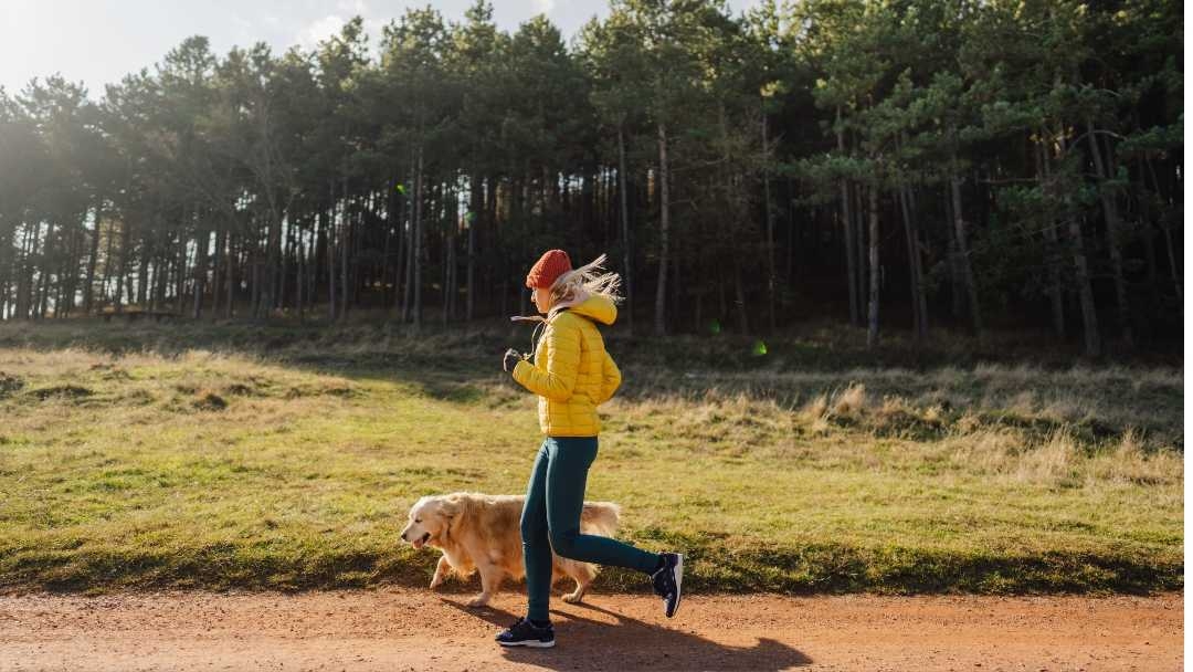 Woman jogging with her dog 