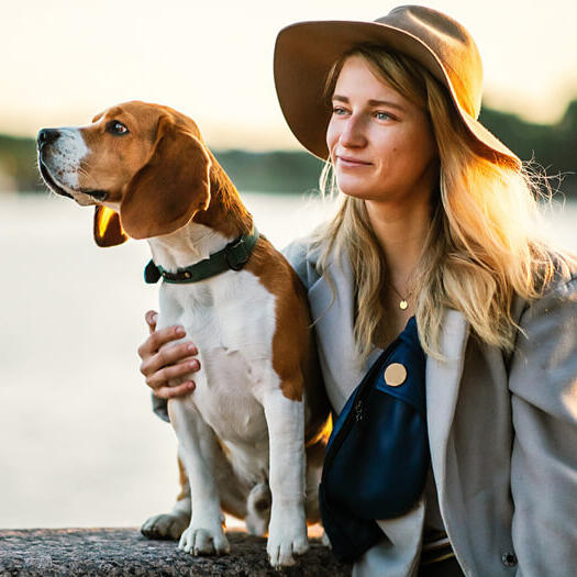 Women with Beagle near the river