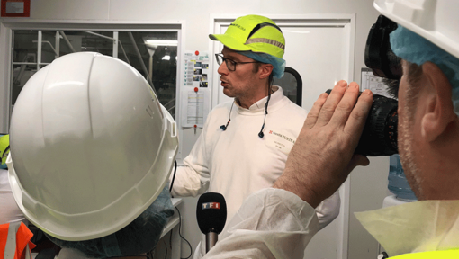 Men in a factory with hardhats on