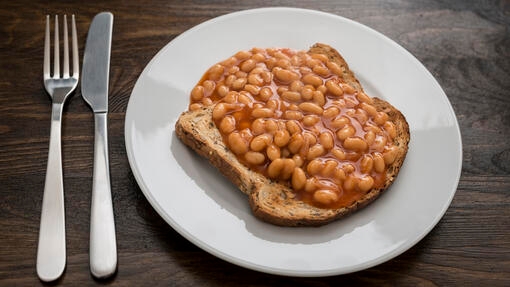 A plate with baked beans 