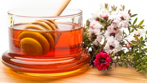 A jar of honey and flowers