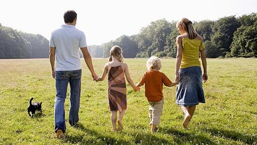 Family walking with dog