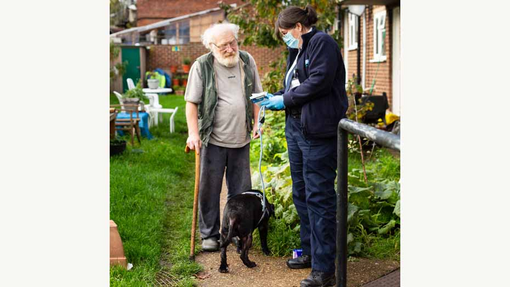 Dog owner and RSPCA staff member