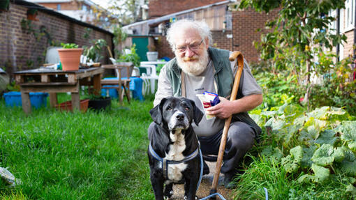 Owner with adopted dog in the garden