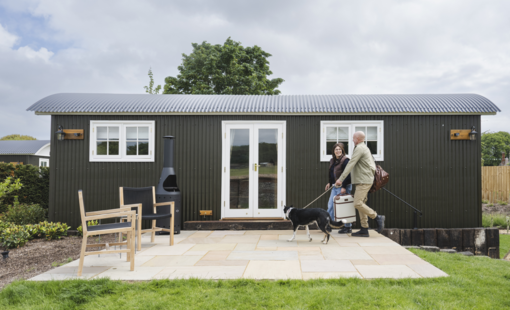 Dog and owners staying at a holiday lodge
